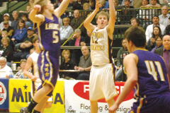 Junior Kyle Bagnell shoots the ball as a Laurel defender tries to block it.